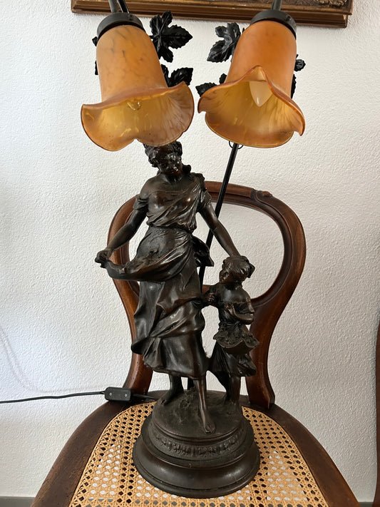 Art Nouveau figural double lamp with woman and child, dark patinated spelter base